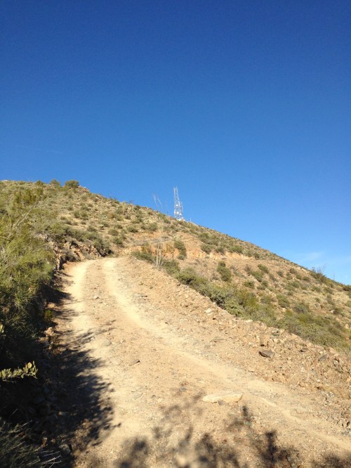 Dirt road in between concrete sections near the summit